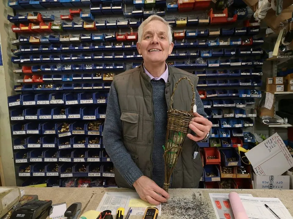 Behind the counter: the wall of parts bins, every one labelled by hand